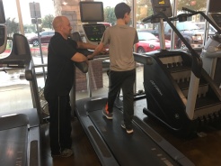 Working on walking on the treadmill with his trainer, Lee.